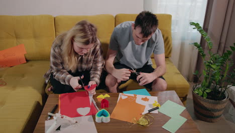 couple creating cards together at home