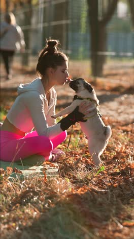 woman and her pug in autumn park