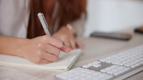 writing in a notebook