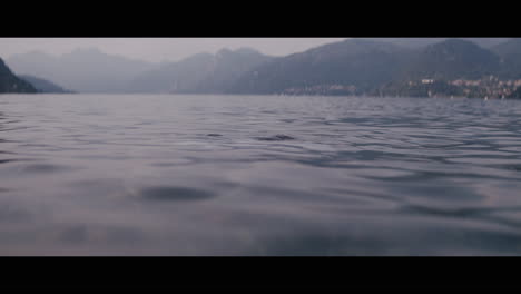 man swimming in a lake