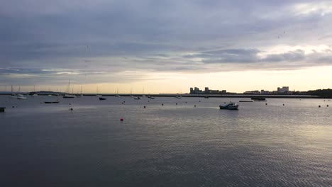 Expensive-yachts,-pleasure-boats-and-catamarans-docked-at-a-city-marina,-at-sunrise-|-Newhaven,-Edinburgh,-Scotland-|-4k-at-30-fps