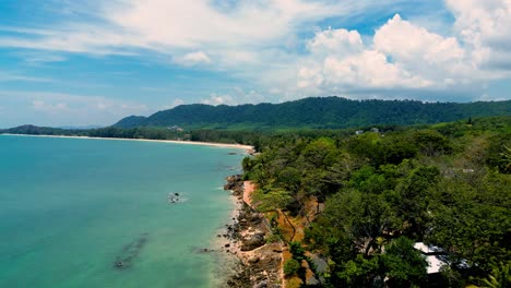 4K-Cinematic-nature-drone-footage-of-a-panoramic-aerial-view-of-the-beautiful-beaches-and-mountains-on-the-island-of-Koh-Lanta-in-Krabi,-South-Thailand,on-a-sunny-day