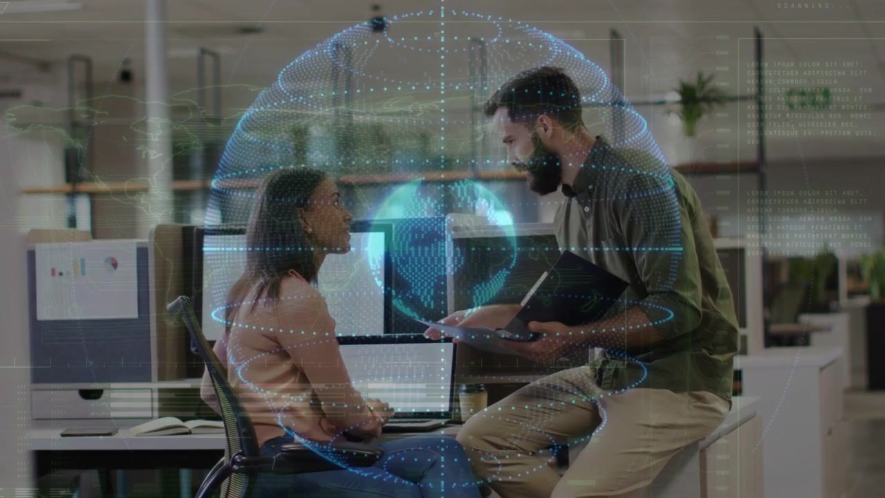 Male coworker walking up, pointing at laptop, female typing, reviewing business under hologram