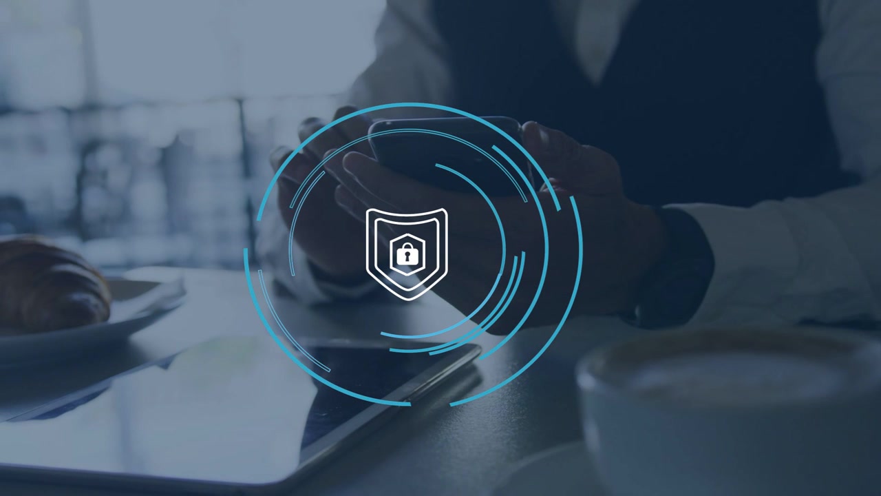 Man tapping phone at cafe table, initiating pulsing shield and rings around phone securing data