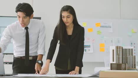 team of creative architects working together in a architect studio