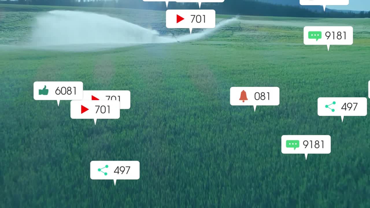 Animazione di icone social con numeri su paesaggio con irrigatore d'acqua su campo