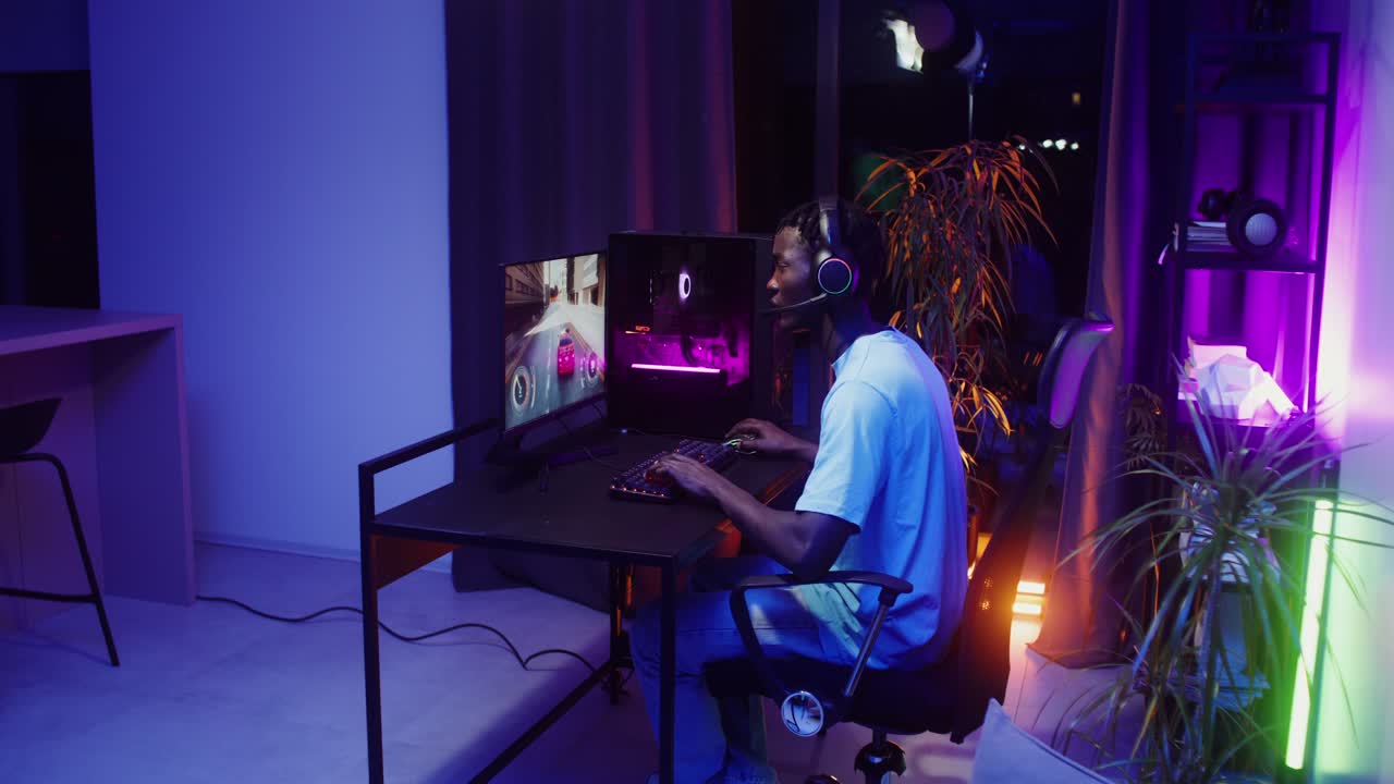 Gamer playing video games on computer