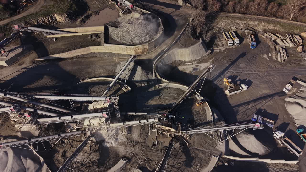 Mining equipment at operation in a busy quarry site with materials
