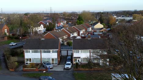 rainhill typical british suburban village in merseyside, england aerial view pan across autumn residential council neighbourhood