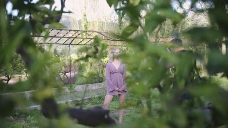 woman in a purple dress in a garden