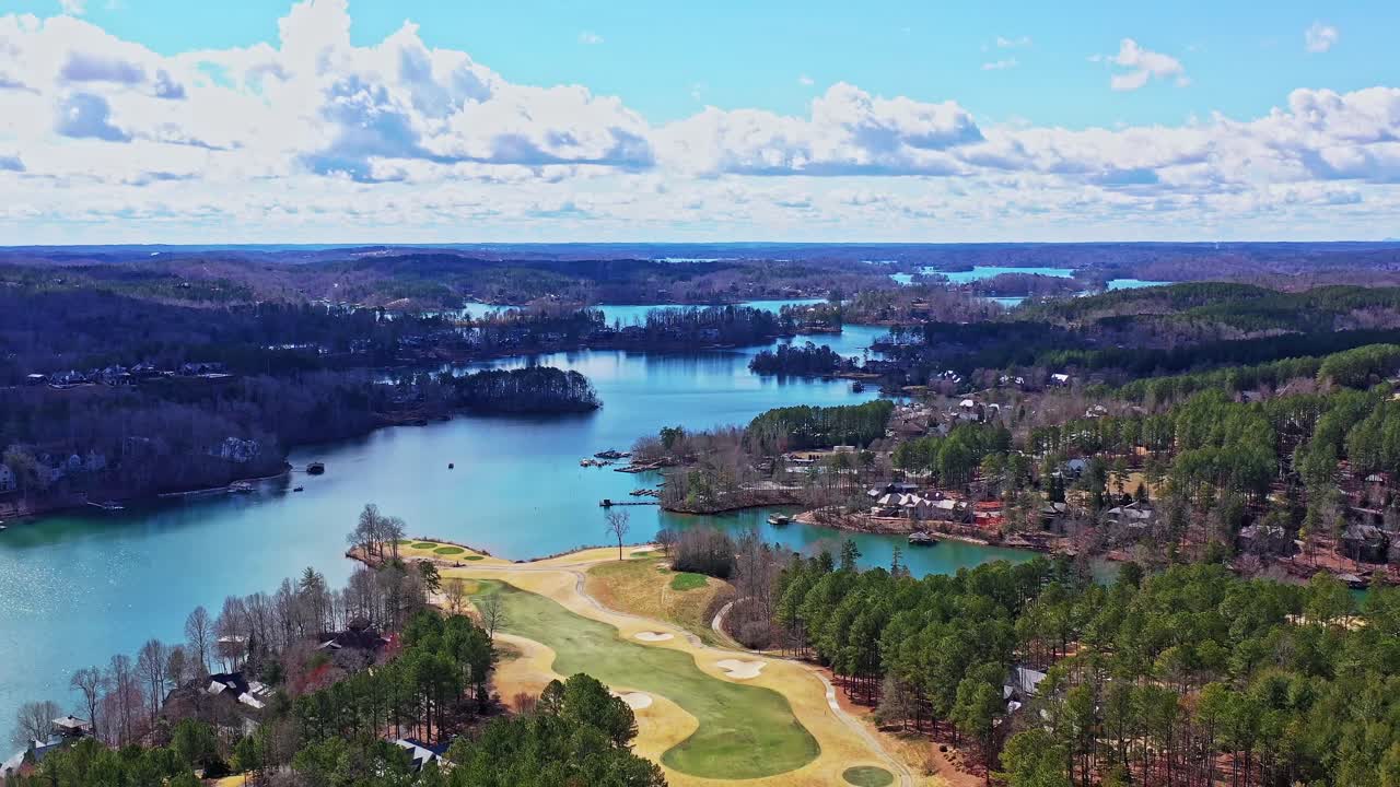 Drone pulls away from Lake Kiwi and the Jack Nicklaus Signature Golf Course.