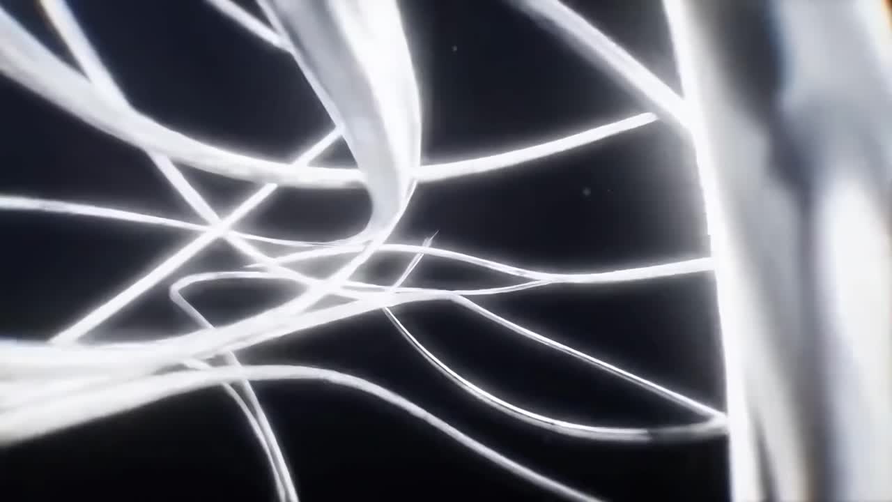 Video dinamico con linee bianche vorticose su uno sfondo scuro, ripreso da un'angolazione bassa