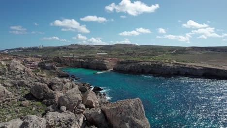 Popeye-Village-Theme-Park-In-Malta-With-Rocky-Shoreline-And-Turquoise-Water