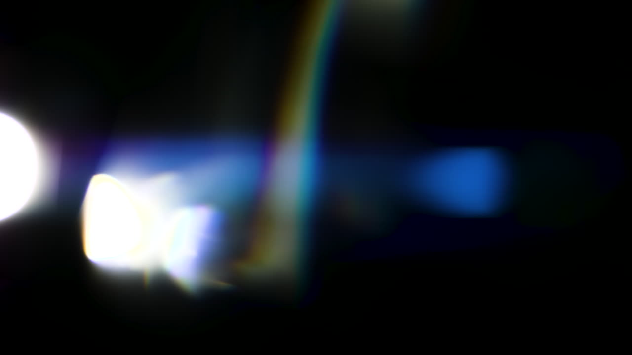 Beautiful, stunning light reflections and anamorphic blue streaks shot on black with high-end cinema anamorphic lens as a background, light leak overlays or transitions for editors