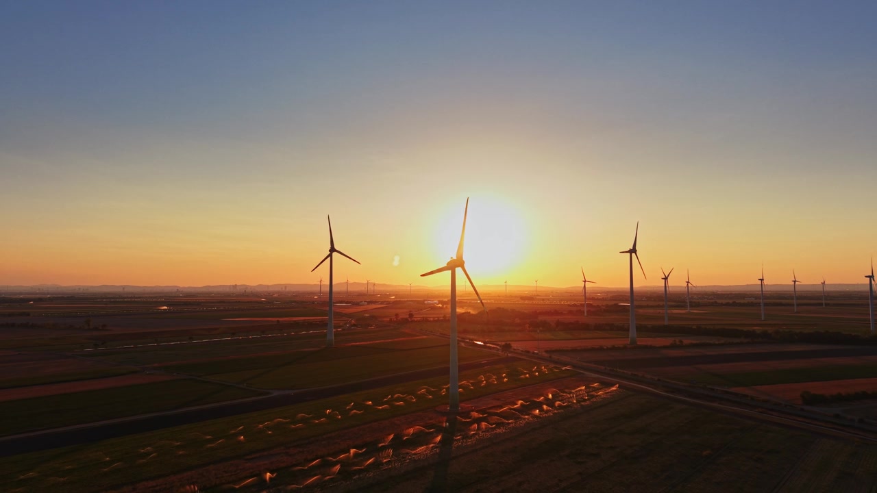 Wind turbines at sunset in a rural landscape