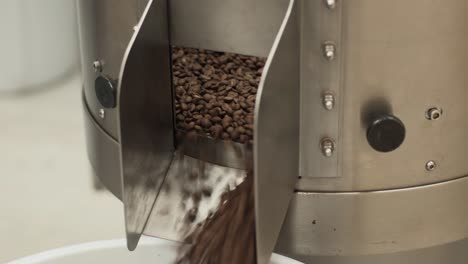 coffee beans coming our of a loring coffee roaster