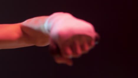 close up of a hand and arm on stage during a performance