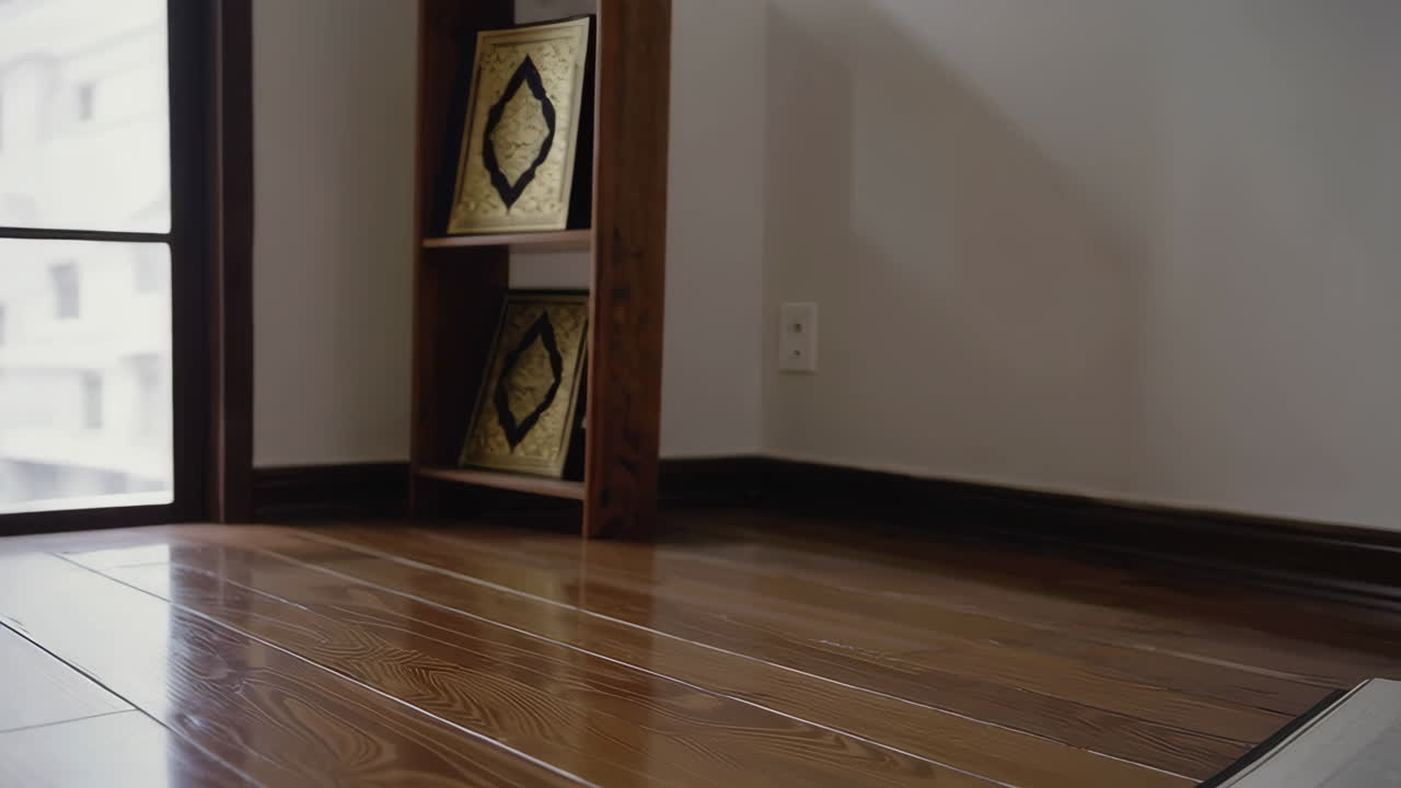 Quran and Rosary on Wooden Floor