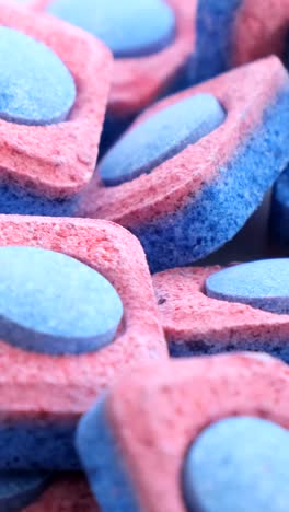 colorful dishwashing granules rotate in a circle detergents for the dishwasher