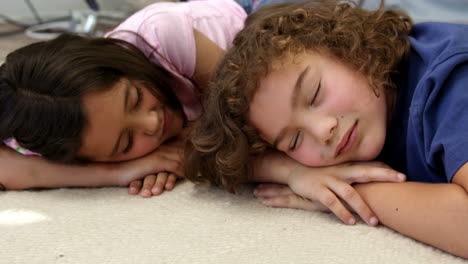 Brother-and-sister-sleeping-on-the-floor