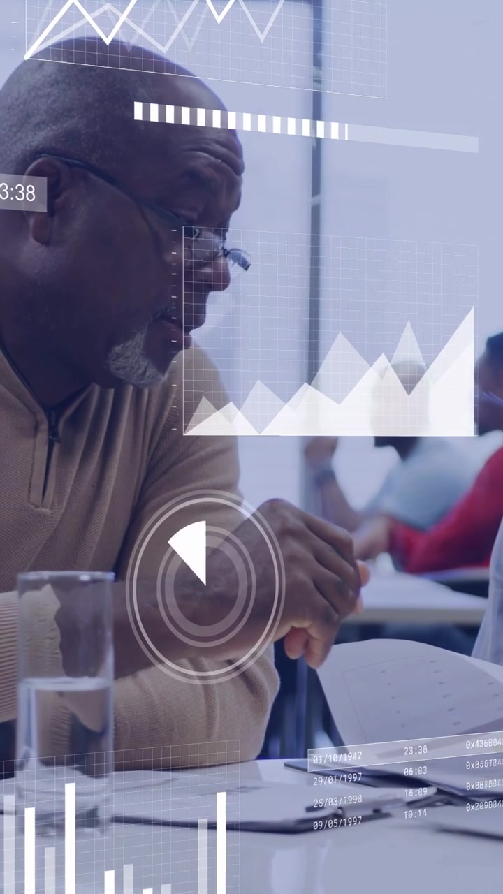 Vertical video: Senior man leaning in reading docs and showing business data as HUD charts floating