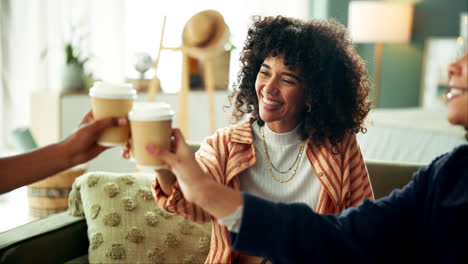 two young women enjoying coffee and conversation indoors