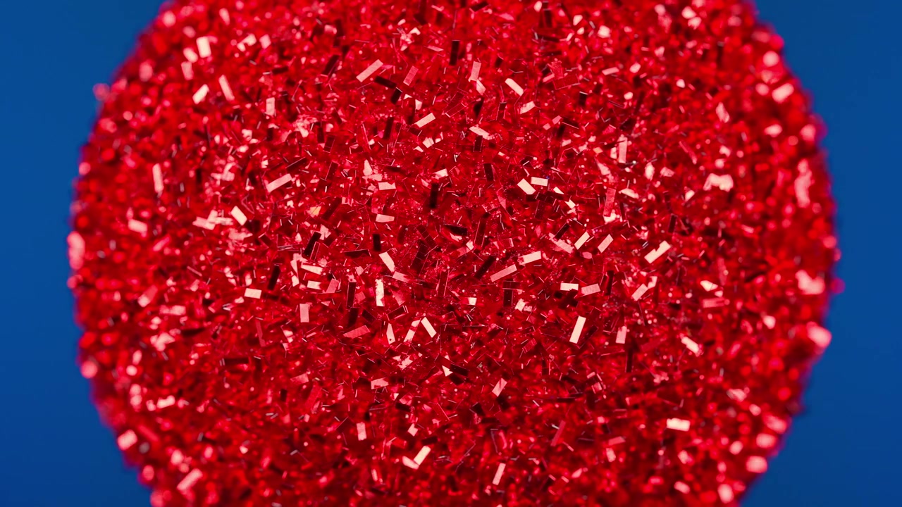 Close-up of Red Glitter Texture on a Blue Background