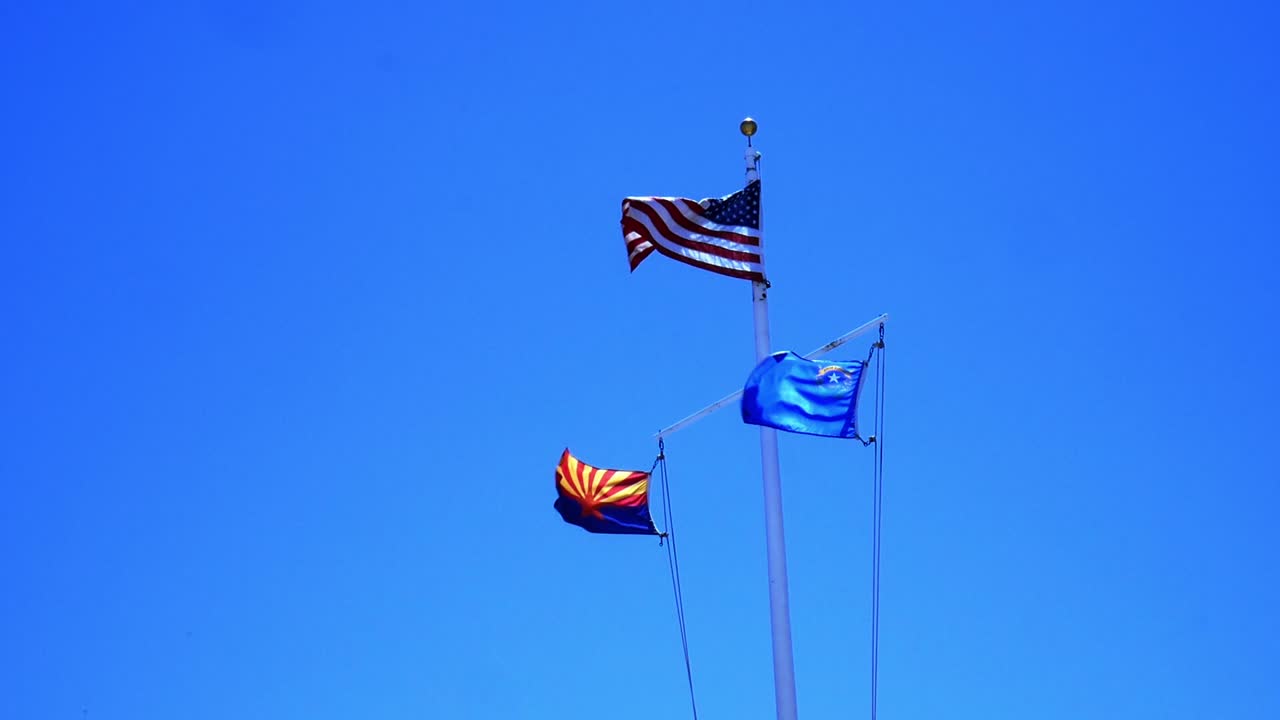 American flags against a clear sky - stars and strips, arizona, nevada