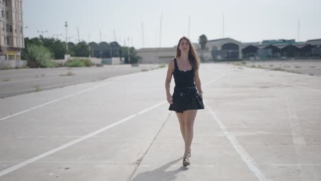 woman walking on an empty urban road