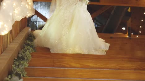 Dress-sways-as-bride-walks-down-stairs