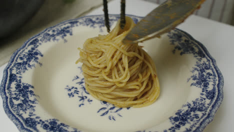 plating pasta bolognese. close up. plating pasta dish