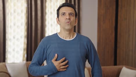 indian man having acidity problem after eating