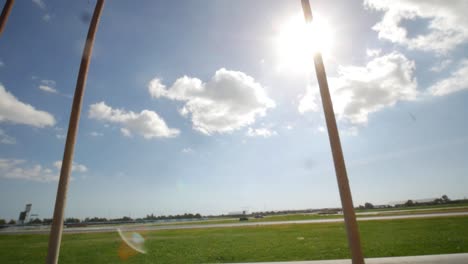 a look over the railing to reveal a car racetrack on a sunny day with cinematic lens flares