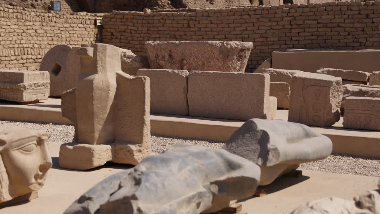 Ancient stone ruins and carved sculptures at the Dendera Temple complex