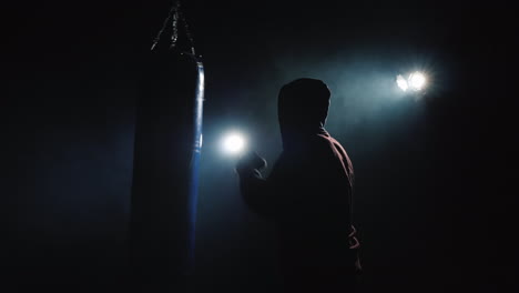 beginner boxer trains with boxing pear