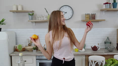 Girl-recommending-eating-raw-vegetable-food.-Showing-tomatoes-in-hands.-Weight-loss-and-diet-concept