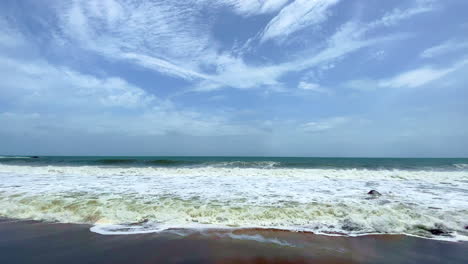 Sea-surface-with-waves-under-blue-sky-Cola-Beach-Goa-India-4K