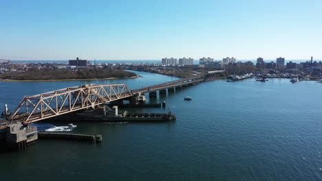 an aerial drone shot over grassy bay in queens, ny