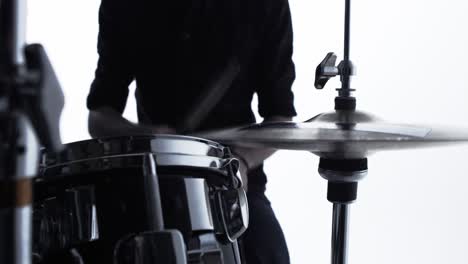 close up of drummer playing drum kit in studio shot on r3d