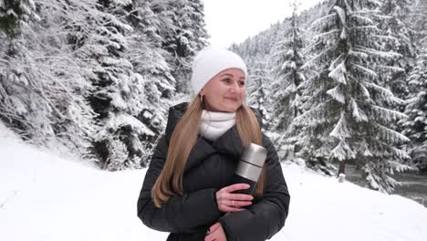 happy caucasian young pretty woman enjoying morning coffee hot drink and walking on city street happy caucasian young pretty woman enjoying morning coffee hot drink and smiling outdoors relaxing taking a break girl walking on urban city center street drinking coffee to go town lifestyles