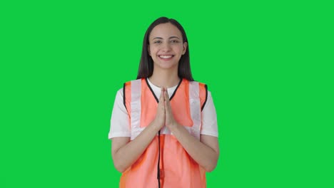 Happy-Indian-ground-staff-girl-doing-Namaste-Green-screen