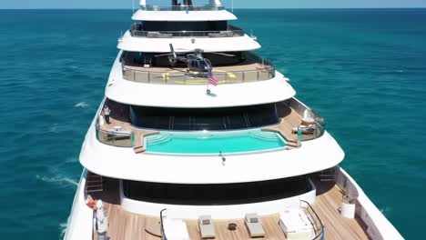 luxurious mega yacht featuring a helicopter pad and stunning ocean views, showcasing ultimate relaxation and opulence on the water