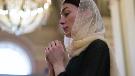 woman praying in the church