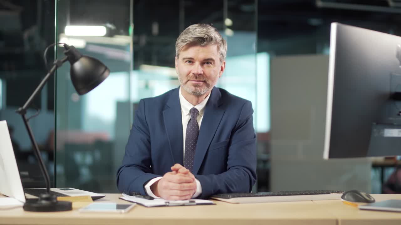 bearded man listen online seminar, meeting, conference or lecture, looking at camera remotely. Webcam view. Mature male worker businessman in suit on video call connection