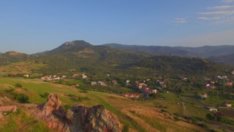 Aerial:-A-rock-on-top-of-a-hill-on-Lesbos-island,-Greece