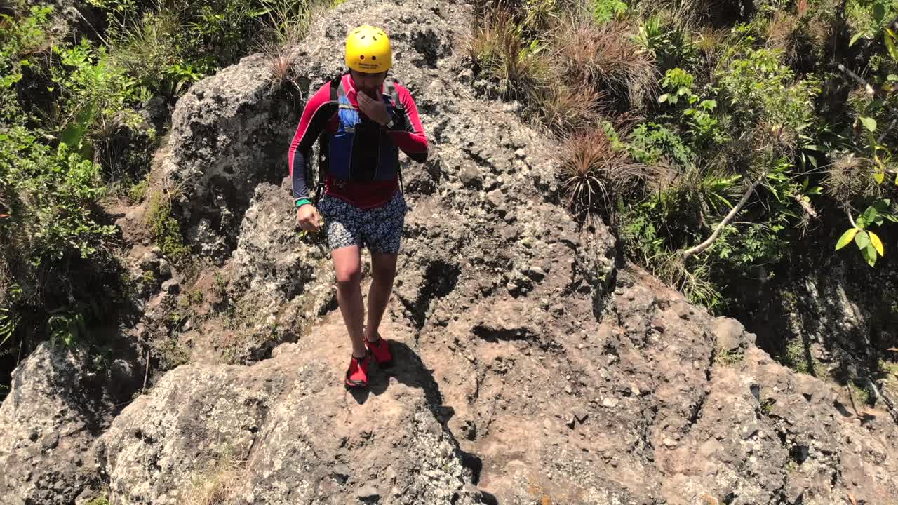 Aerial View of a River with Rocks and Lush Vegetation