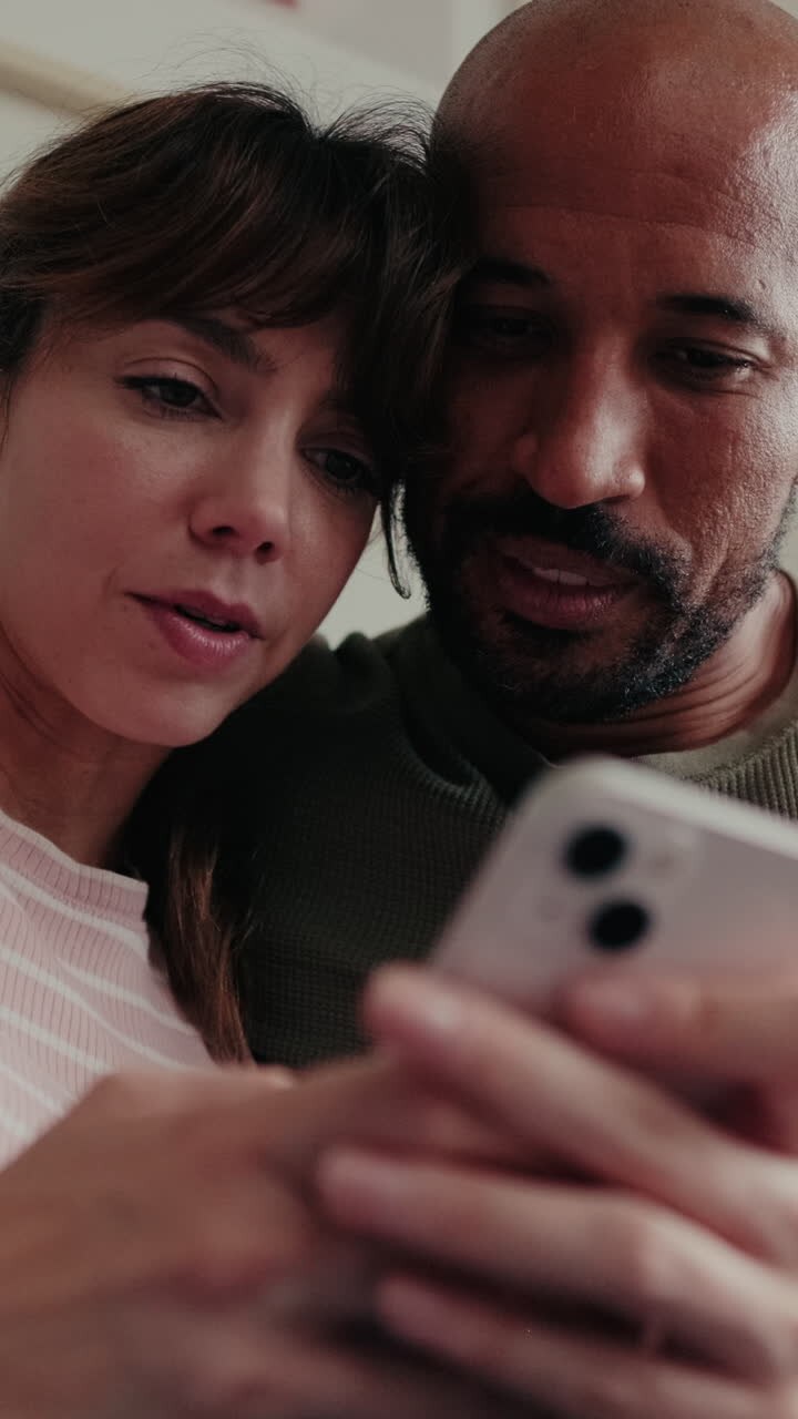 Couple at Home Browsing Mobile Phone