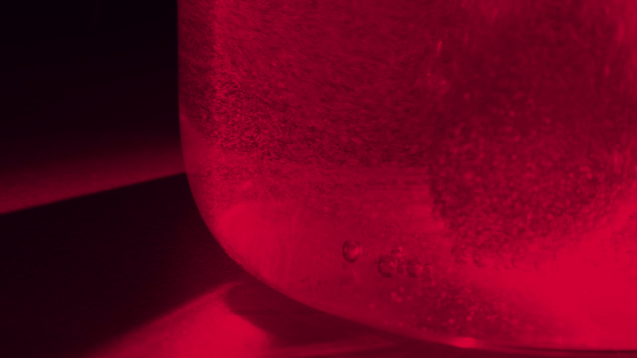 effervescent tablet in glass of water slow motion shot, white round bubbling aspirin in water, pill dissolves with bubbles healthcare pharmaceutical industry drugs pill treatment