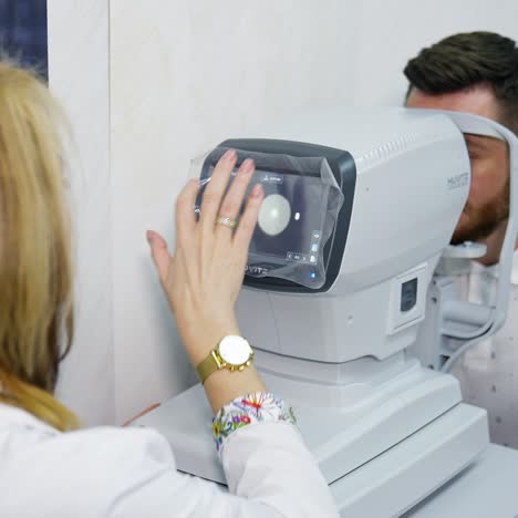 female optometrist checking patient vision