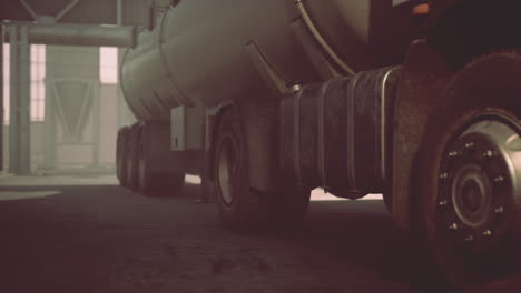 large white cistern trucks in a factory